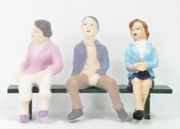 Show details for Young woman sitting with a bag Picture of Young woman sitting with a bag